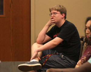 Alex J Van Allen, history junior, listens to the discussion between students and the academic search team about the qualities of the next president Monday in Dillard 189. Photo by Lauren Roberts