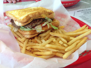 The grilled cheese cheeseburger with fries.