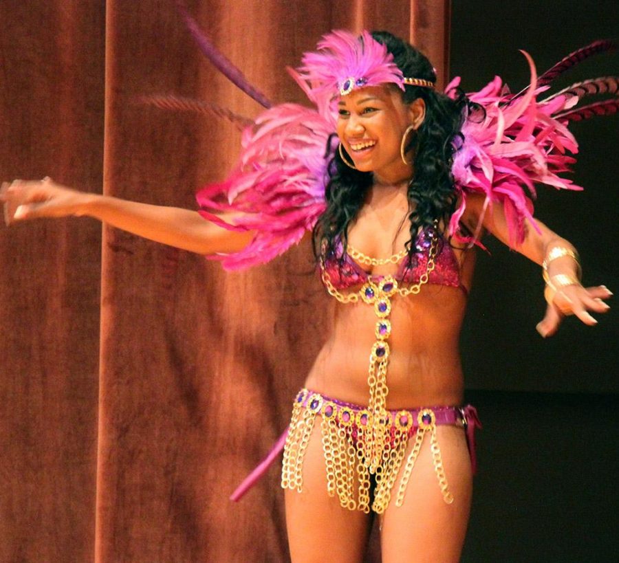 Delle Geaorge, premed junior, displays her costume in the Costume and Personality portion during the Caribfest Pageant Wednesday night in Akin Auditorium. Pageant started 45 minutes late, but the house was still packed with more than 300 people for the show. Five contestants competed in the Miss Caribfest Pageant, with Indira Placide winning the crown. Photo by Rachel Johnson