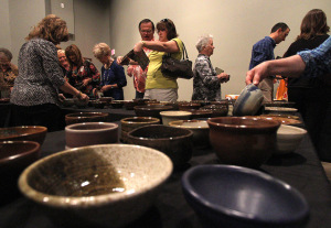 Attendees choose their bowl at the Empty Bowls event at the WIchita Falls Museum of Art at MSU Tuesday afternoon. Photo by Lauren Roberts