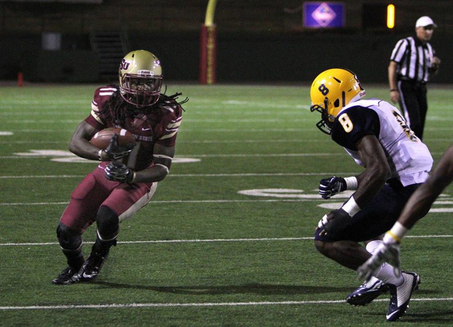 Levy Wilson, junior wide receiver, runs after the catch before being pushed out of bounds in the game between Midwestern State University and Texas A&M-Commerce, Oct. 25, 2014 at Memorial Stadium. Photo by Lauren Roberts
