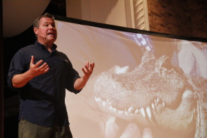 Jeff Crowin spoke to the audience while members of the crowd got the chance to hold an alligator  during his visit to Midwestern State University, Artist Lecture Series, Oct. 2, 2014. Photo by Sam Croft
