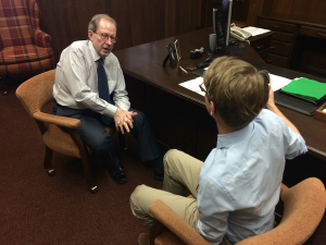 Ethan Metcalf interviews University President Jesse Rogers for the first podcast. Photo by Bradley Wilson