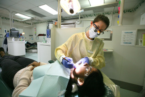 Makenna Smith, dental hygiene senior, begins examing Swati Gurbhele, biology graduate student Gurbhele said she heard about the dental clinic in an email and wanted to get a cleaning before she graduates in December. Photo by Ethan Metcalf.