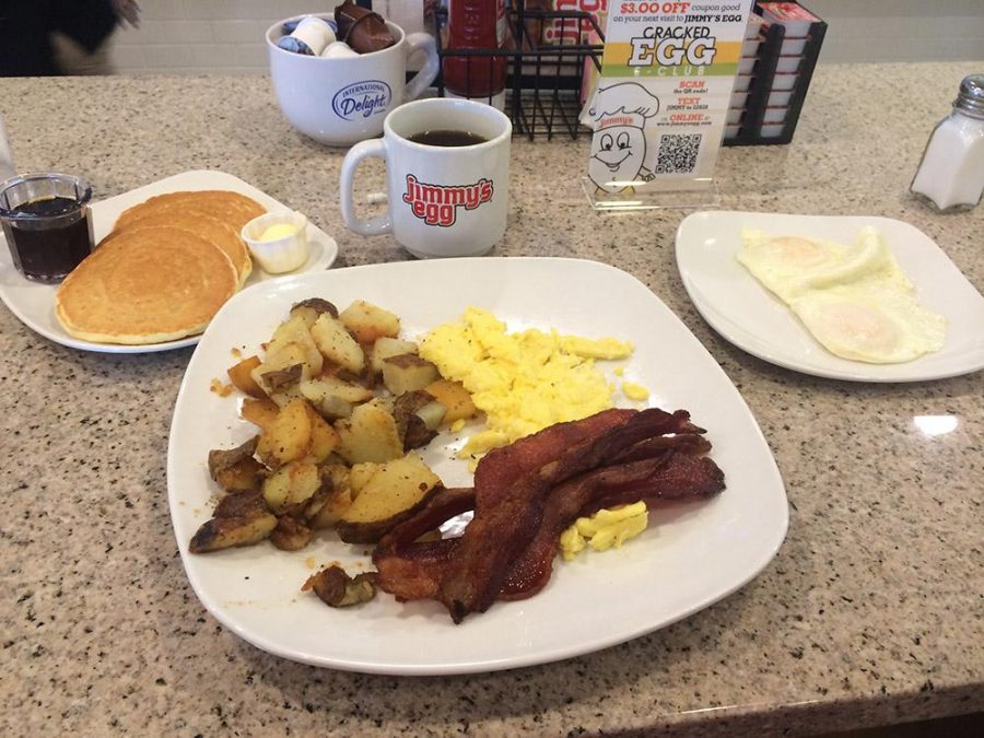 Jimmys Eggs traditional breakfast: bacon, home fries, three pancakes and two eggs made to order.