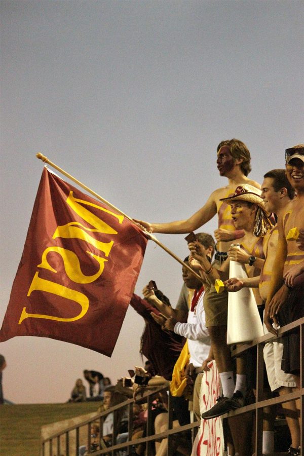 The Stang Gang leads the student section at the 2014 Homecoming game, also being the last game of season, on Saturday at Memorial Stadium. Sabina Marroquin, history education senior, won 2014 Homecoming Queen and Elijah wire, sport and leisure studies senior, won 2014 Homecoming King. Photo by Rachel Johnson