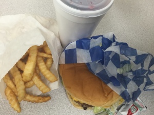 Cheesburger and fries with "Scott's Famous Cherry Lime" from Scott's Drive In. Photo by Courtney Gilder.