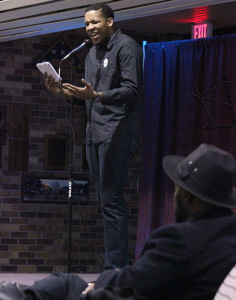 Brett Lincoln, mass communication junior, performs two poem at the UPB Poetry Night, featuring ODD?ROD, held in the Atrium of the Clark Student Center on Thursday Feb. 26, 2015. Over 100 students were in attendance for this Balck History Month event. Photo by Rachel Johnson