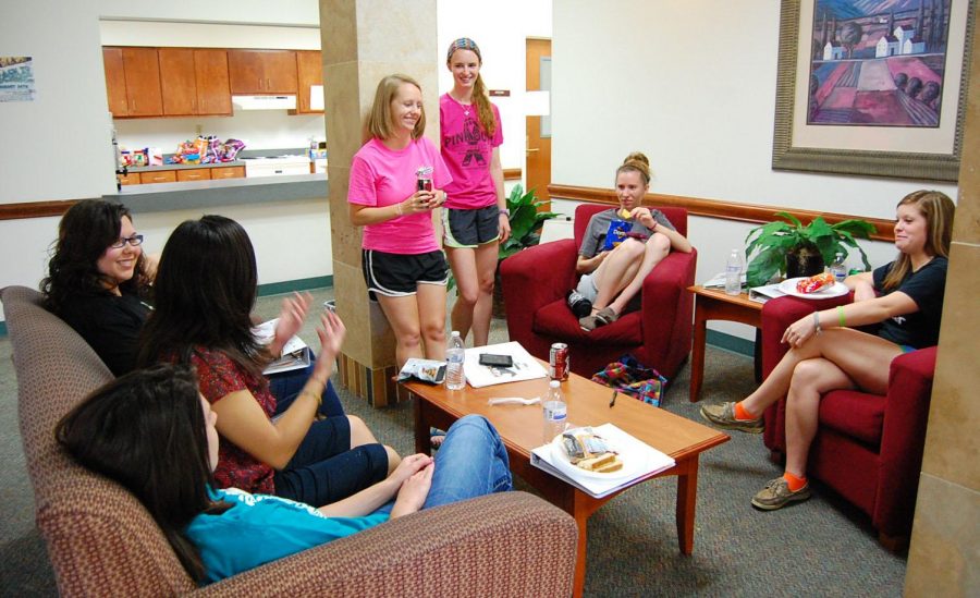Resident assistants Kelsie Allen, sophomore in nursing, Ashley Minx, senior in social work, Mae Johnson, sophomore in nursing, Ashley Brown, senior in nursing, Kimberly Nowell, senior in education, and ­Rebecca Stogner, sociology junior, get together and prepare for the fall semester Aug. 16, 2013. File photo by Hanwool Lee.