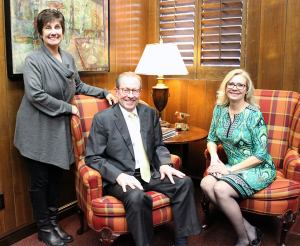 The Ladies' of the President's office: Ruth Ann Ray, assistant to the president, and Cindy Ashlock, executive assistant to the president, with Rogers. Debbie Barrow is not pictured. Photo by Rachel Johnson
