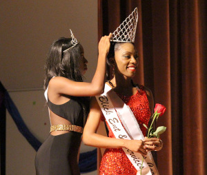 Jorrey Martin, speical education sophomore, is crowned Miss CaribFest 2015 by Miss CaribFest 2014, Indira Placide, biology senior, at the end of the 2015 CaribFest Pageant, Sept. 23. Photo by Kayla White