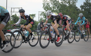 Cyclists Joshua Buchel, accounting freshman, and Cameron Lowery, nursing junior,  race in the crit race of the Hotter'N Hell on Aug. 28, 2015. Photo by Kayla White