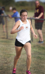 Angela Powers, nursing freshman, powers through the finish line after running at Midwestern State Invitational at Lake Wichita Park Oct, 8. Photo by Francisco Martinez