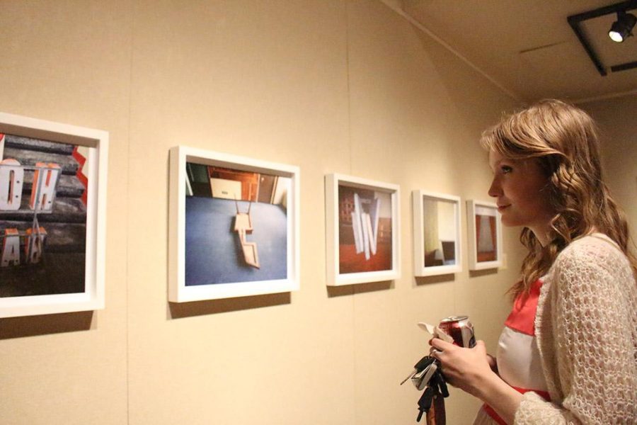 Josie Wise, art freshman, review over the featured photos at the opening recepetion of Existe Lo Que Tiene Nombre: Contemporary Photography in Mexico displayed at Juanita Harvey Art Gallery on March 4th. Photos by Kayla White.