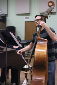 Austin Monson, sociology junior, plays the cello during orchestra practice held in the big practice hall in the Music Department, March 1. Photo by Rachel Johnson