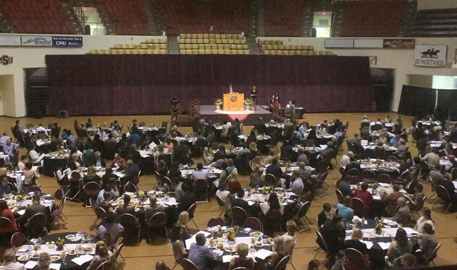 Students, sponsers, and guests sit at decorated and reserved tables at the Honors Recognition Banquet in the D.L. Ligon Coliseum on April 22. Photo by Kayla White.
