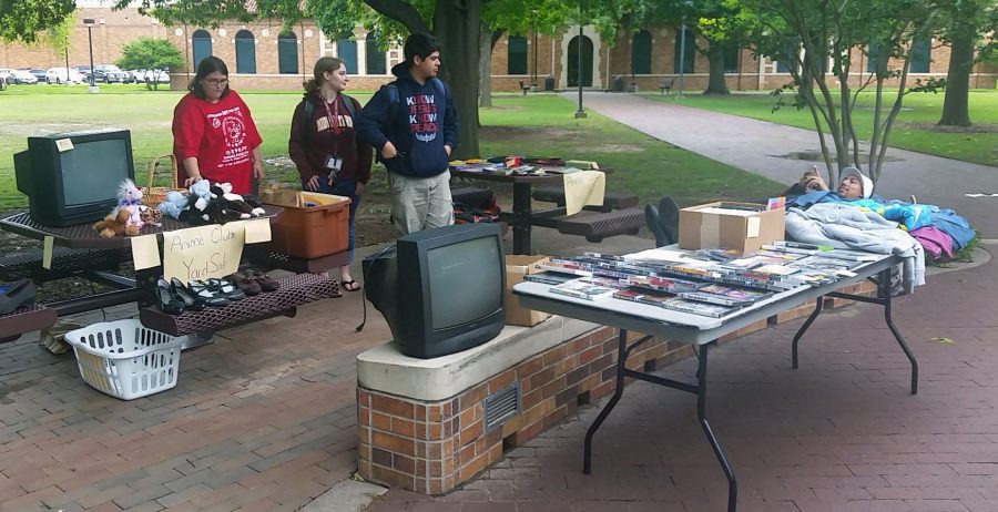 Rebecca Blevins, Jocelyn Taggart, and John Bell help out at the Anime club yard sale April 20. Photo by Dierrica Smith
