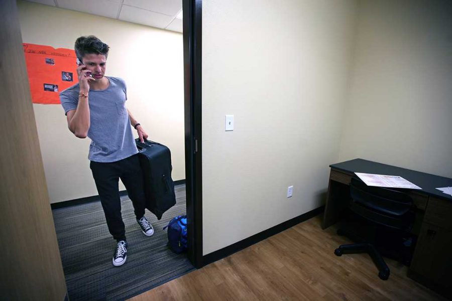 Jordan Smith, criminal justice freshman, goes in to his room for the first time during Move-in for Legacy Hall at Midwestern State University, Aug. 20, 2016. Photo by Bradley Wilson
