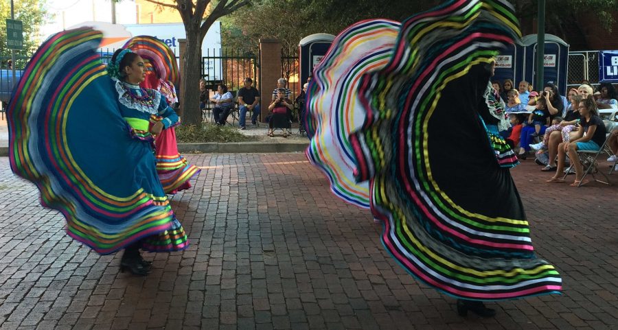 Members of Grupo Folklorico Faisan, a travelling group from California, perform at Calle Ocho on Oct. 1 at the downtown Farmers Market. Photo by Emily Simmons