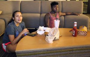 Marissa Rios, athletic training freshman, and DJ Ellison, business management, watch "Dance Moms" in lieu of the Vice Presidential Debate Oct. 4. Photo by Dewey Cooper.