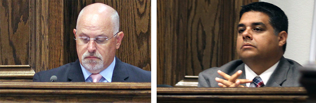 Tim Ingle and Stephen Santellana, city councilmen, attend a City Council meeting Oct. 4. Photo by Dewey Cooper