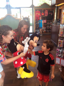 Miranda Townson and a coworker interact with a child at Disney World.