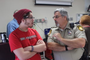 Pretending to argue, Benton Fields, theater performance freshman, and George Ohmstede, campus police officer, partake in the Adult Code simulation Nov. 18th. Photo by Brendan Wynne.