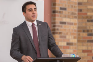 Manny Hoffman, Republican debater and political science senior speaks about immigration policy at the Midwestern State student debate in Dillard College of Business building. Nov 2nd. Photo by Izziel Latour