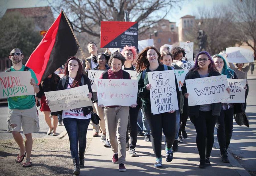 Students and faculty march through the streets of campus protesting the immigration executive order Feb. 1. Photo by Bridget Reilly