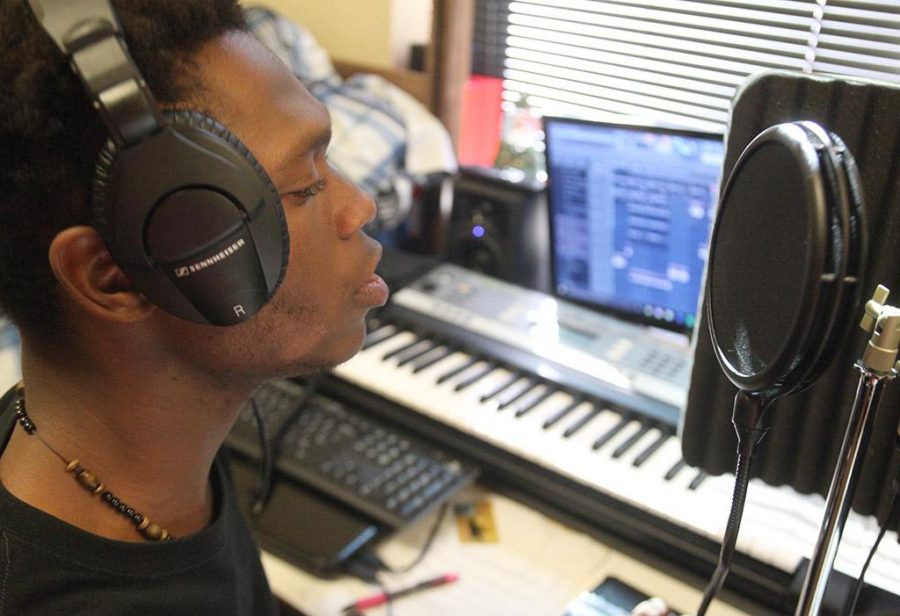 Able-Olu Jordan, computer science sophomore, practices with his professional recording equipment. Photo by Rachel Johnson