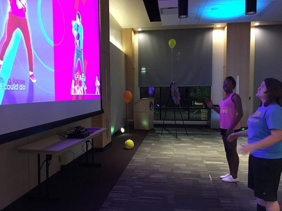 University Programming Board members Kenadi Campbell and Nikatha Conlay compete in Just Dance battle at Just Dance Dance Off March 30.