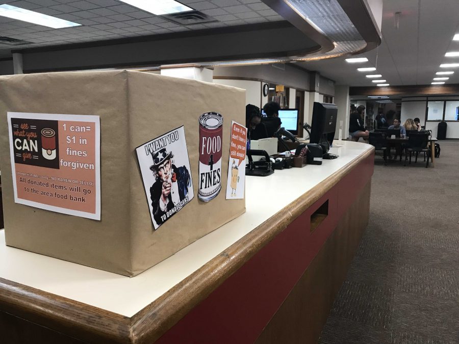 Moffett Library staff hosts annual food drive, Food for Fines, and set out a box for student donations. Photo by Joanne Ortega.