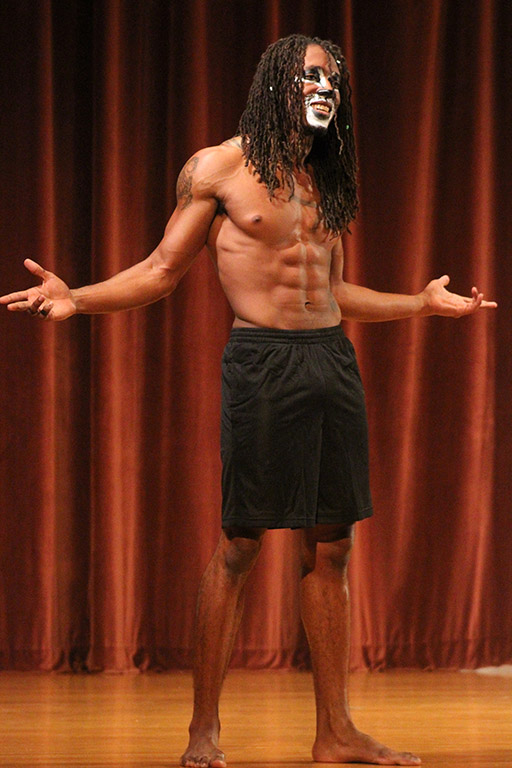 Edward Collins, psychology freshman, poses for the audience and judges during the swim wear portion of the 2017 Mr. and Miss Caribfest Pageant held in Akin Auditorium Sept. 28. Photo by Marissa Daley