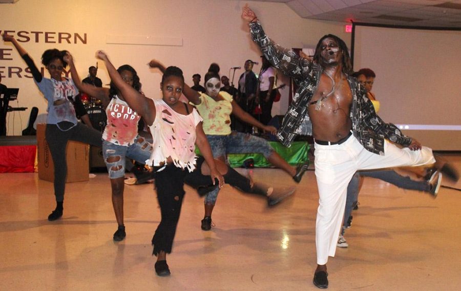 The group O.K turns zombie as they dance to the song Carnival Jumbie for the 2017 Caribfest Soca Show hosted in the Sikes Lake Center on Sept. 29. Photo by Marissa Daley