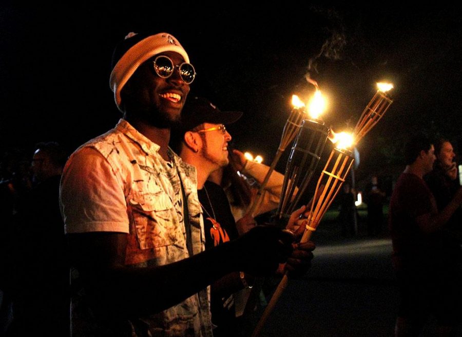 Anthony Onwuegbuchu, mechnical engineering junior, at the homecoming torchlight parade, Oct. 19. Photo by Sara Keeling