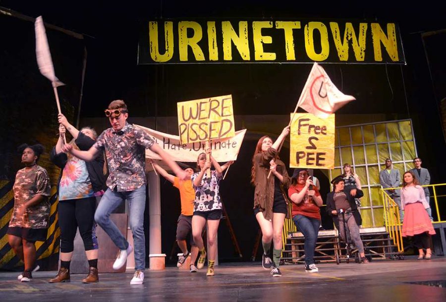 Cast members run through act I finale during rehearsal for Urinetown Thursday, Feb. 15, 2018. Photo by Robin Reid
