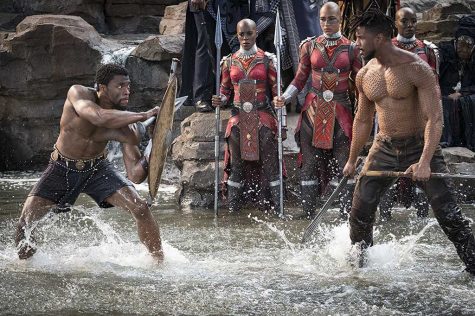 Michael B. Jordan, Chadwick Boseman, and Janeshia Adams-Ginyard in Black Panther (2018)