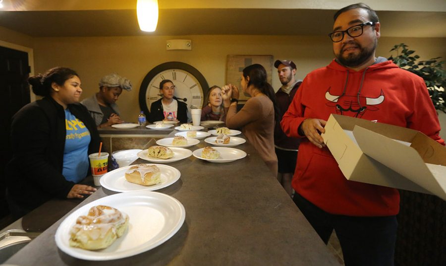 Claudio Rodriguez,  complex coordinator, is excited at the sight of a cinnamon roll during the Late Night Breakfast at Sundance community kitchen on Tuesday, March 6, 2018. Photo by Francisco Martinez