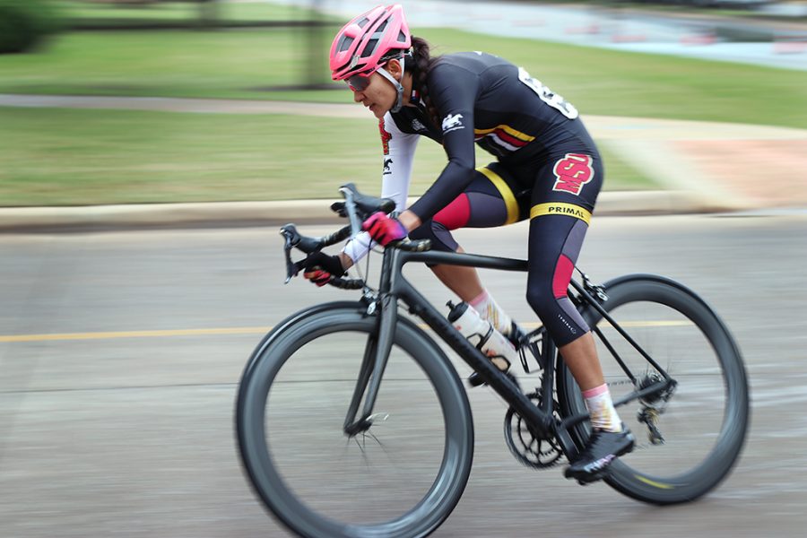 Brissia Montalvo, exercise physiology graduate, rounds the corner of Taft Blvd and Nocona Trail during one of the first couple of laps in the Womens A and Mens B race at the 2018 Vuelta del Viento at Midwestern State University, Saturday April 21, 2018. Photo by Rachel Johnson