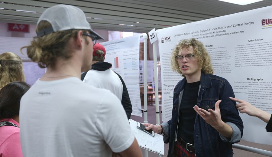 Garrison Horton, English senior, presents his project during the Undergraduate Research Endeavors and Creative Activity Forum Kickoff at Clark Student Center on Thursday, April 26, 2018. Photo by Francisco Martinez