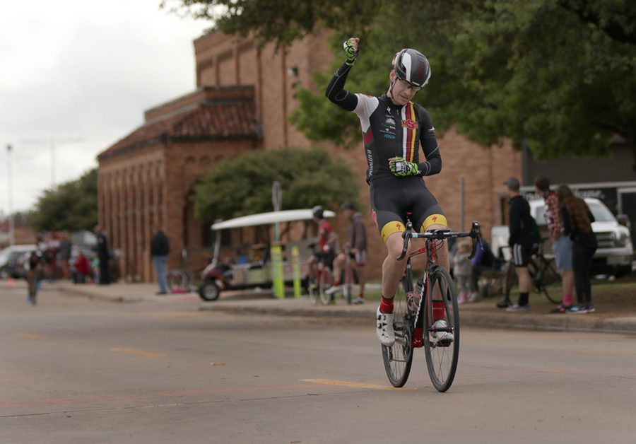 Bill Ash, accounting and finance senior, passes the finish line with a fist held high during the 2018 Vuelta del Viento at Midwestern State University on Saturday, April 21, 2018. Photo by Francisco Martinez