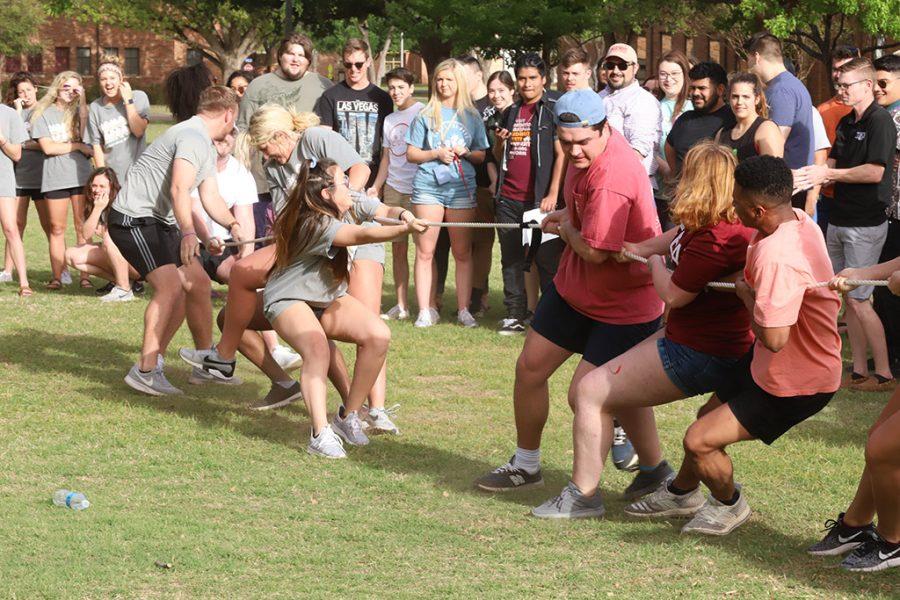 Fraternity and Sorority groups at Midwestern State University are competing in a game of tug of war during Greek Week on the Quad field on Fri. April, 13, 2018. Photo by Harlie David