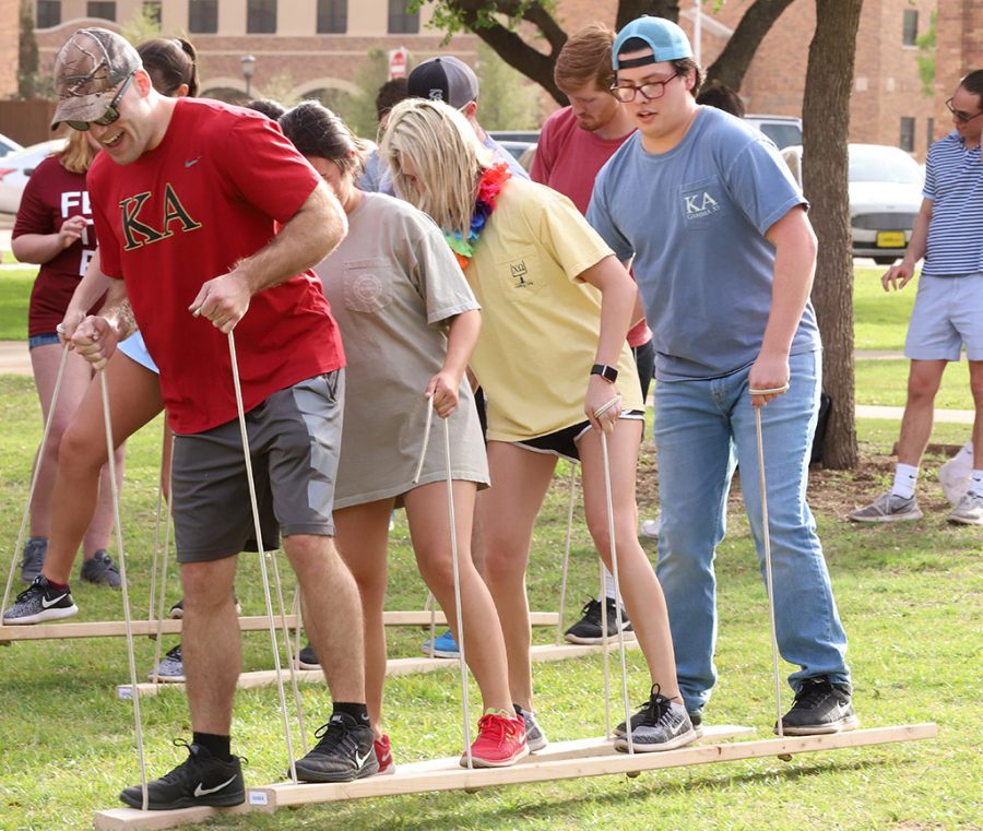 Midwestern State University fraternity and sorority groups compete in a ski race during Greek Week games on the Quad field at Midwestern State University on Fri. April 13, 2018. Photo by Harlie David