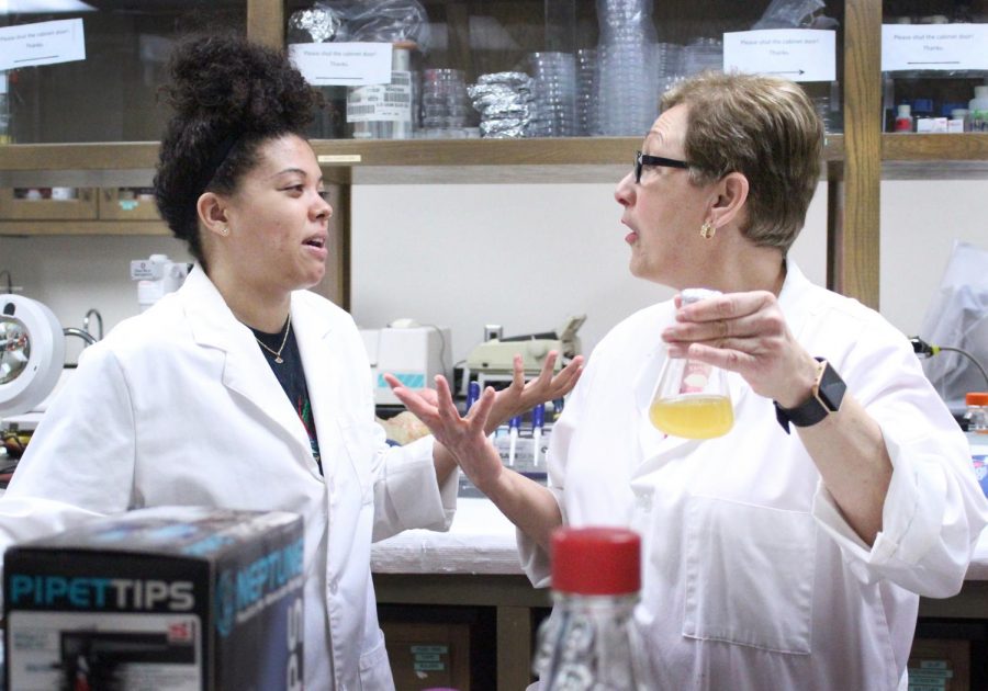 Magaly Rincon-Zachary, biology professor, talks with one of her students, MiKaila Billinger, biology and Spanish junior, about the EURECA reserach project they are working on in the lab, about the results theyve gotten so far and possible directions they could go forth with, April 11, 2018. Photo by Rachel Johnson