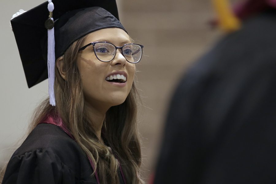 Nizhoni Terronez, mass communication, walks into Kay Yeager Coliseum with other graduates for  the Midwestern State University Commencement on Saturday, May 12, 2018. Photo by Francisco  Martinez