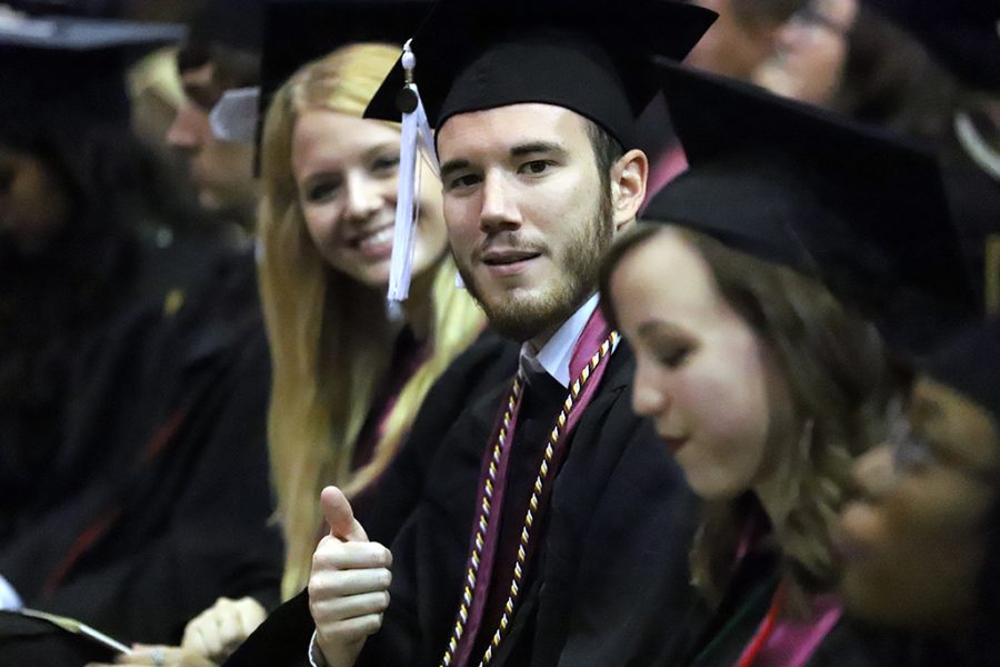 Zachary Davis, humanities and social sciences graduate, gives a thumbs up at the spring 2018 graduation at Kay Yeager Coliseum on May 12, 2018. Photo by Justin Marquart