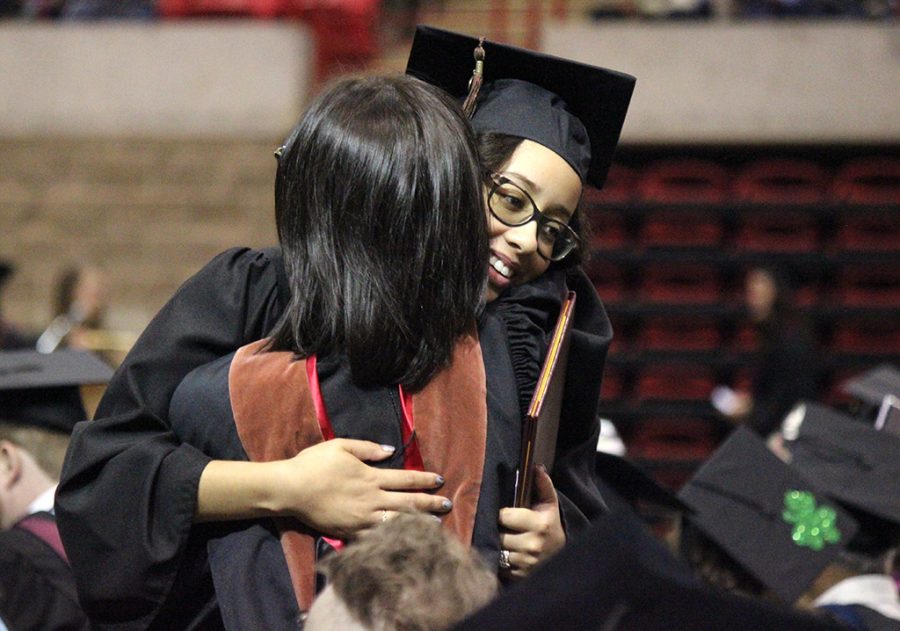 Kaylor Winter-Roach, theater, hugs Christie Maturo, theater professor, after walking the stage at Commencement, May 12, 2018. Photo by Rachel Johnson