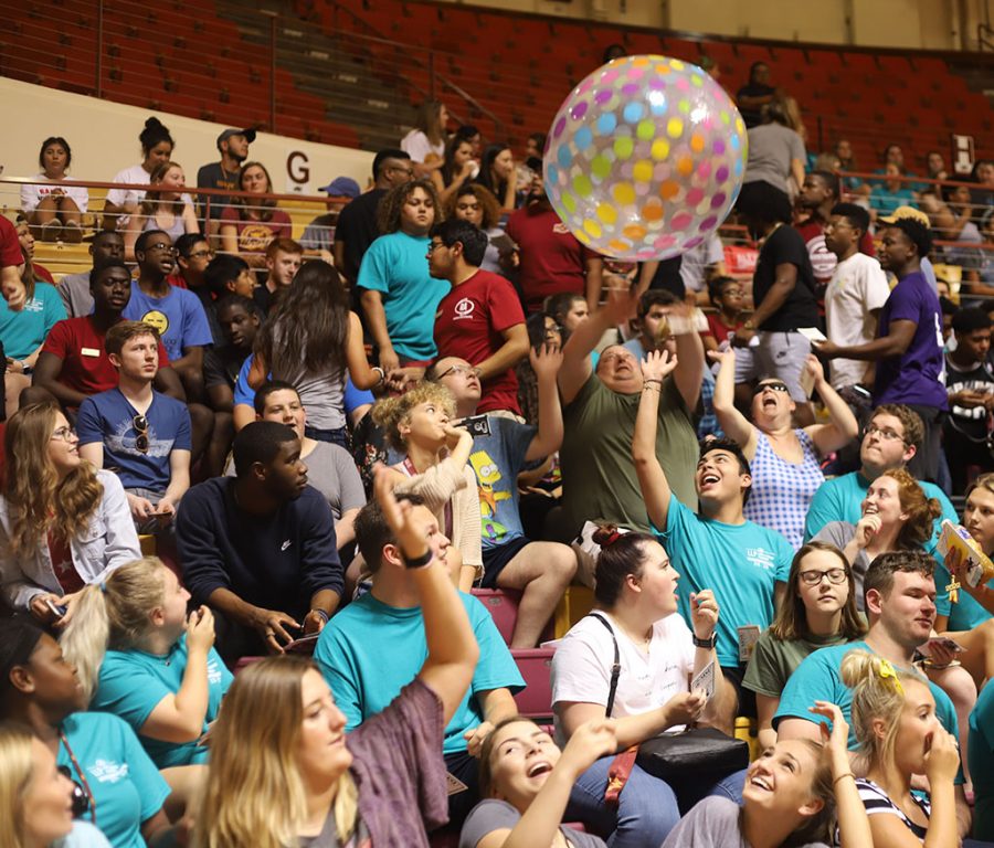 Peyton Alonzo, a freshman in nursing, and Sydney Thacker, also a freshman in ursing, play with inflated ball at the MWSU Convocation in D.L. Ligon coliseum, Aug. 28, 2018. Photo by Stephen Gomez