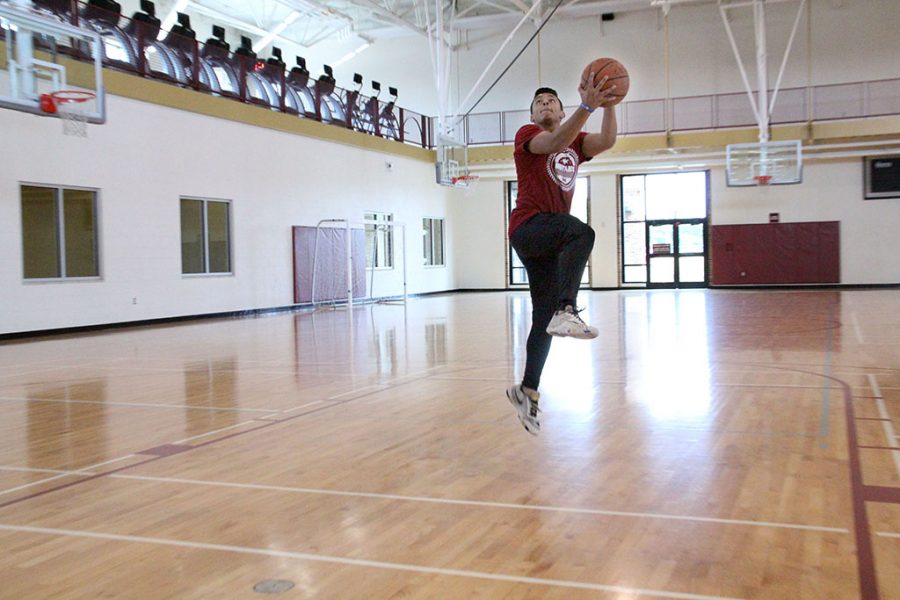 Between class and football, Austin Boyd, undecided freshman, finds time to play basketball to challenge and entertain himself at the Wellness Center on Tuesday, Sept. 4, 2018. Photo by Cortney Wood