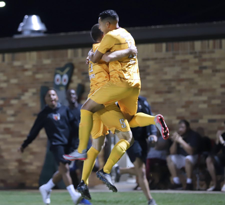 Kinesiology junior and forward Sergio Lara embraces sports and leisure studies junior and defender Dylan Burke after scoring the first goal of the match against St Marys University. Sep 20. Photo by Bridget Reilly